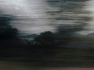 Abstract motion blur of a yoga practitioner moving.